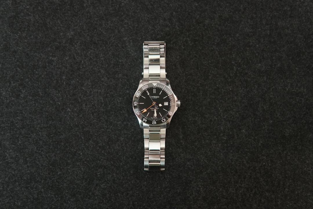 Close-up of a refined stainless steel wristwatch on a wrist