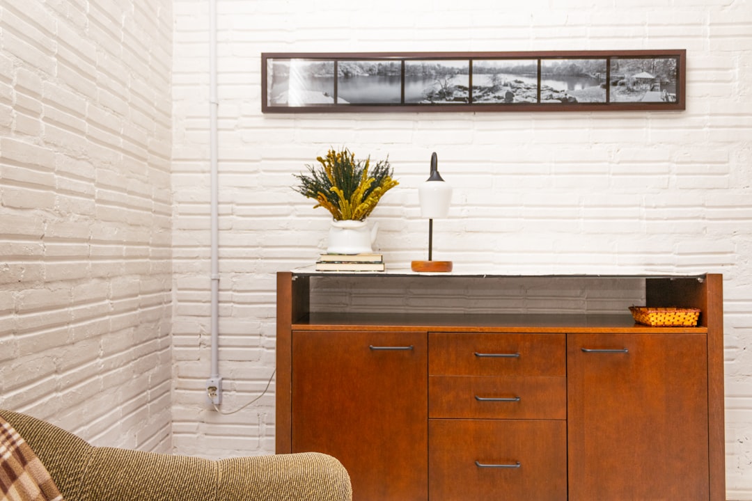 premium closed wooden secretary desk looking like elegant cabinet in living room