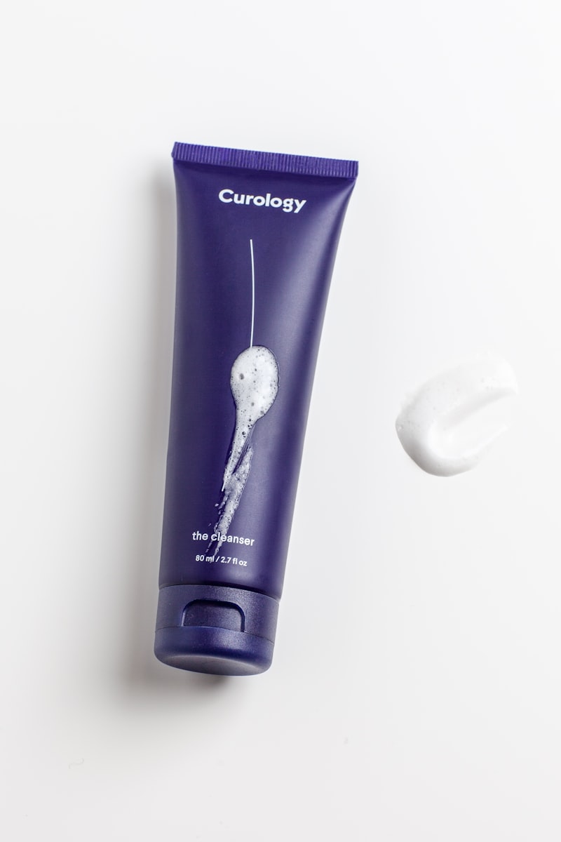 A woman applying a clean facial moisturizer gently